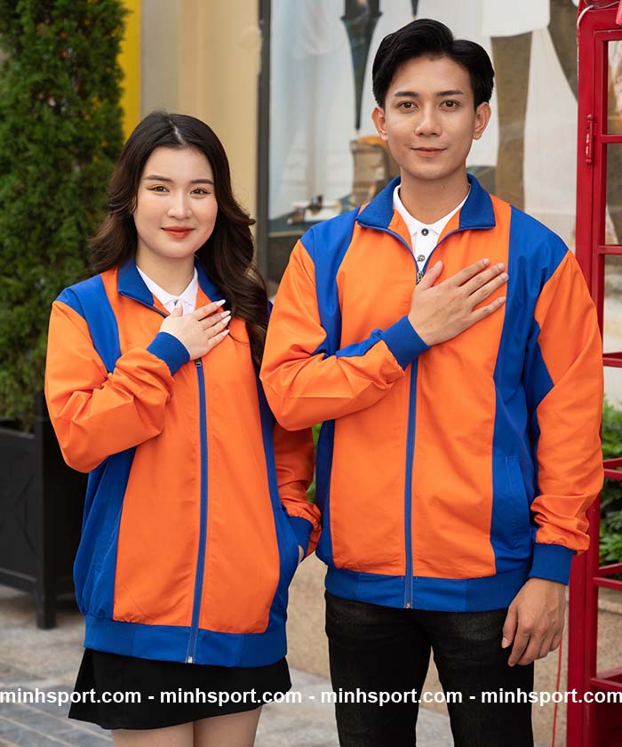 áo khoác gió đồng phục vải dù không nón màu cam phối xanh