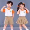 đồng phục mầm non và tiểu học cổ tròn màu màu trắng phối tím
